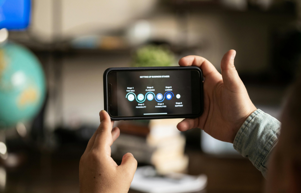 A person managing multiple bank accounts on a smartphone