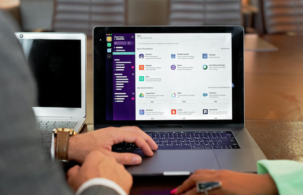 A person surrounded by various dashboards and collaboration apps