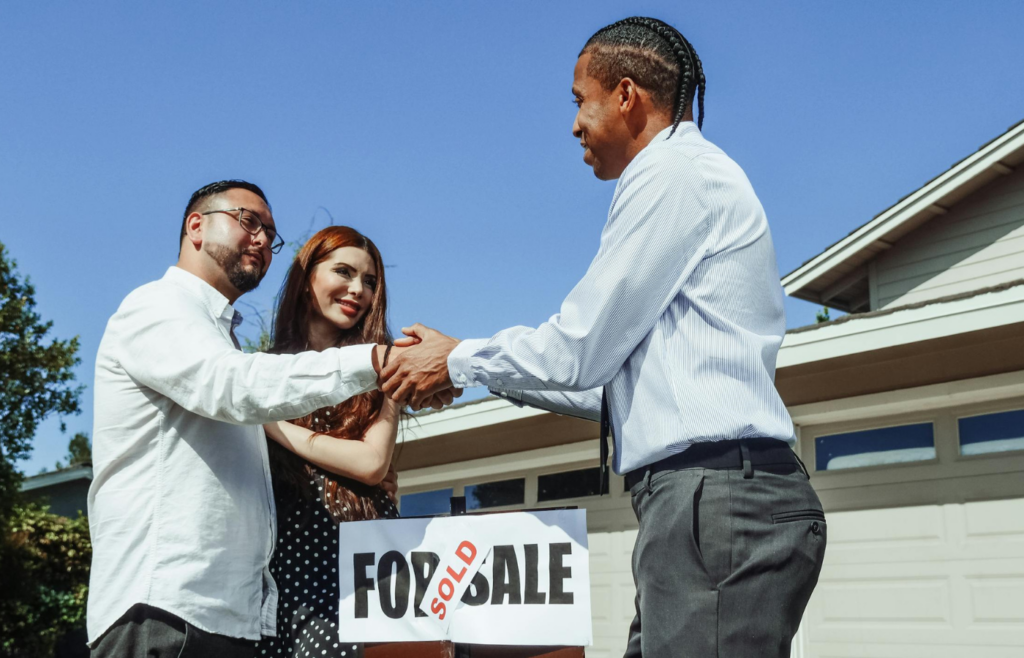 Handshake, "For Sale" sign, house