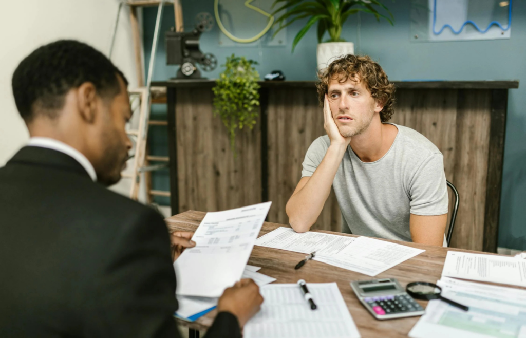 A client consulting with a financial advisor in an office setting