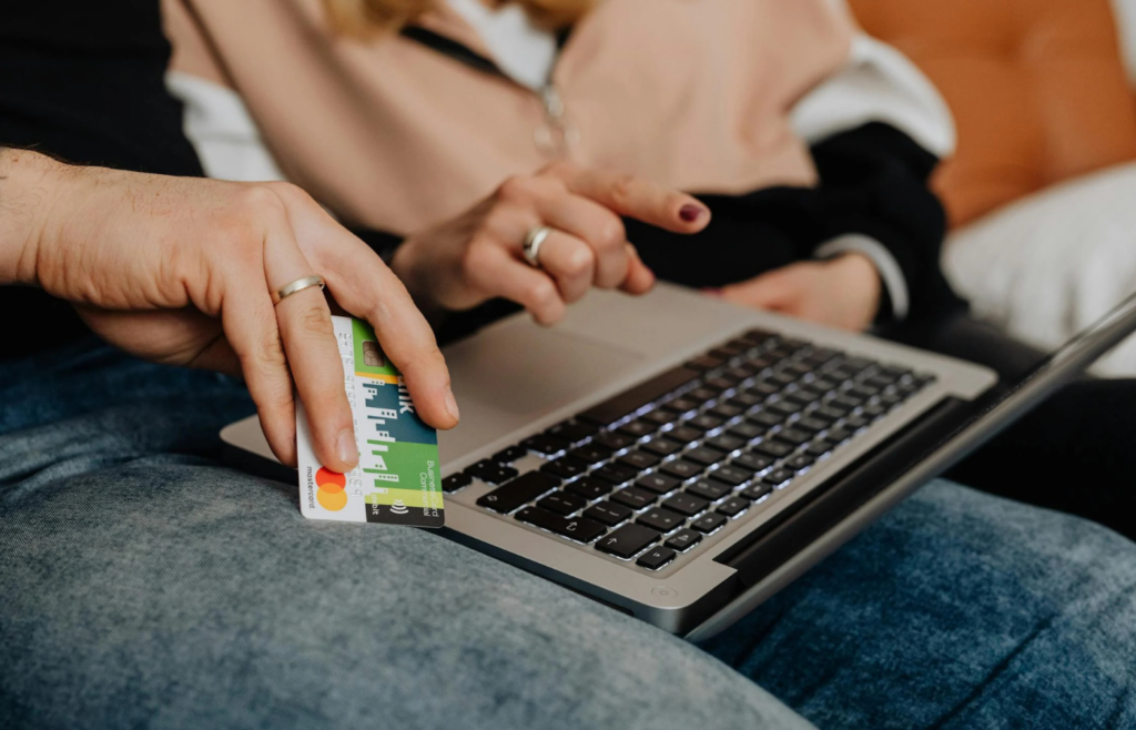 A person is holding a credit card