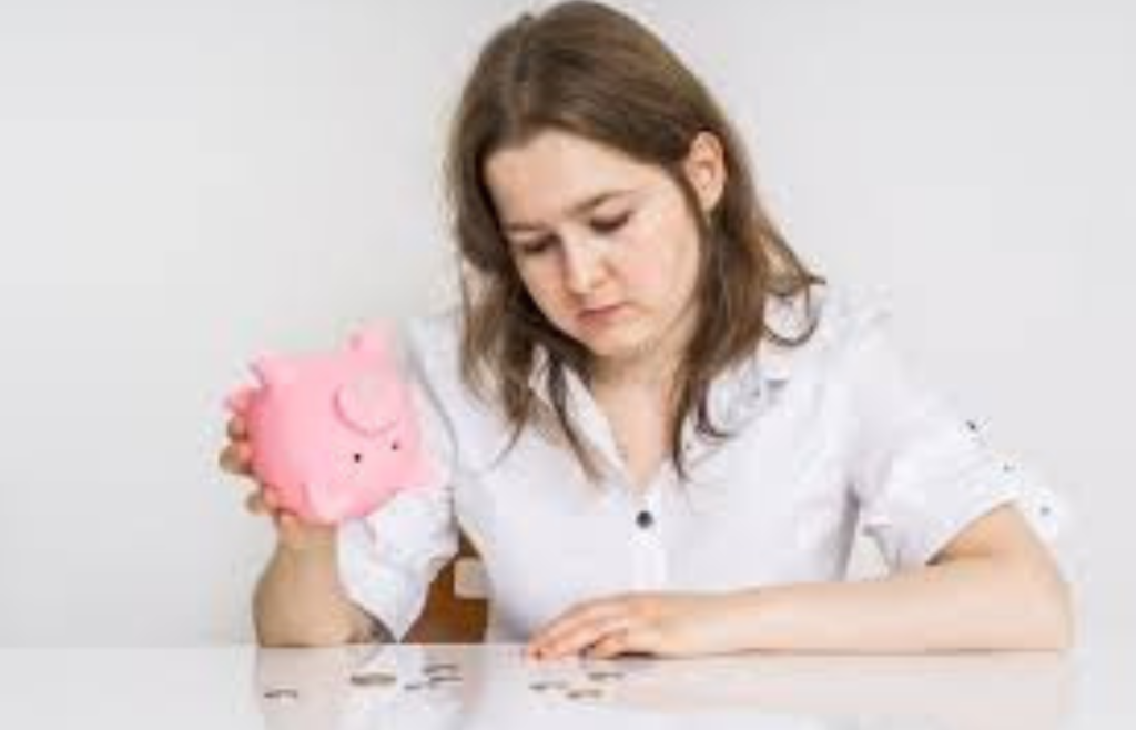 A young adult ignoring a piggy bank on a shelf
