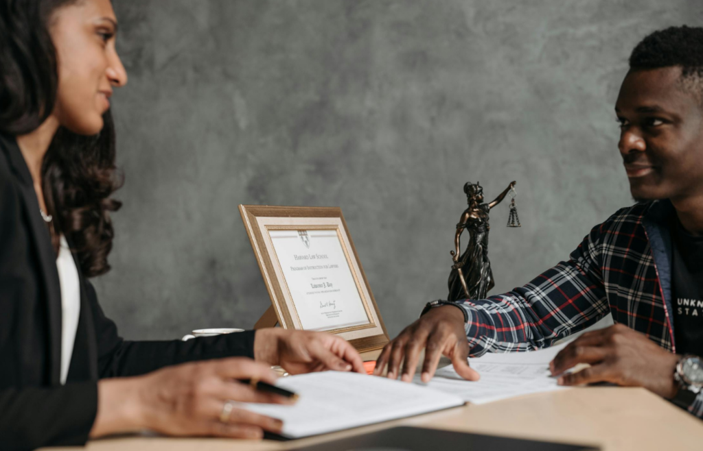 A person reluctantly signing an employment contract without discussion