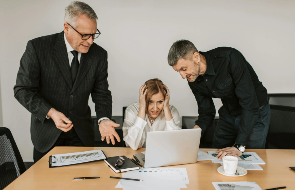 A team working late under pressure with a looming deadline