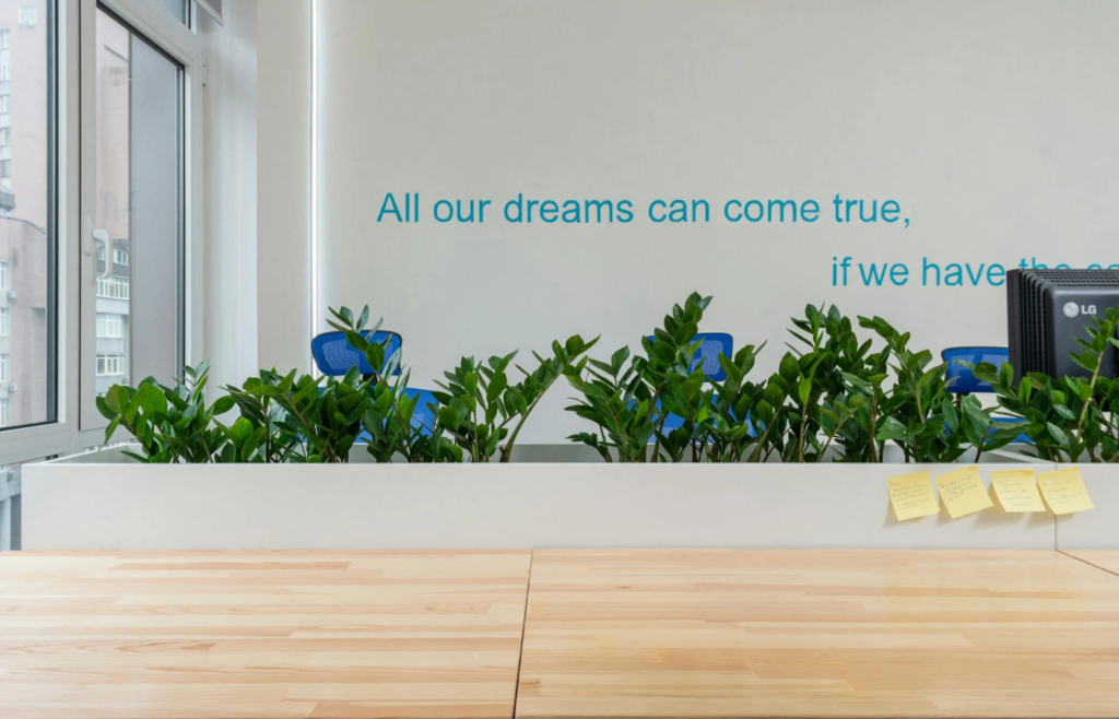 A brightly decorated office space with the phrase displayed prominently