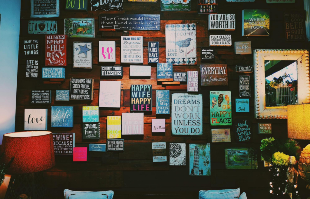 An office wall adorned with motivational quotes about happiness