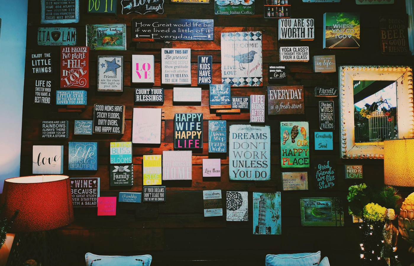 An office wall adorned with motivational quotes about happiness
