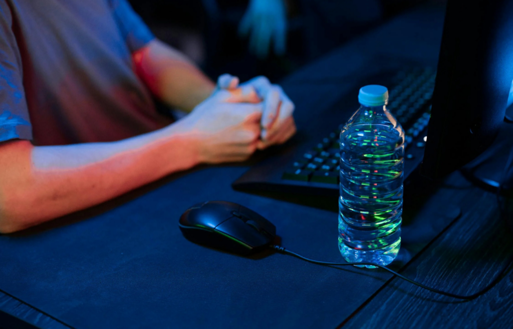 A close-up of a water bottle on an office desk