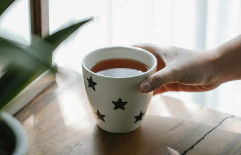A person choosing herbal tea over coffee