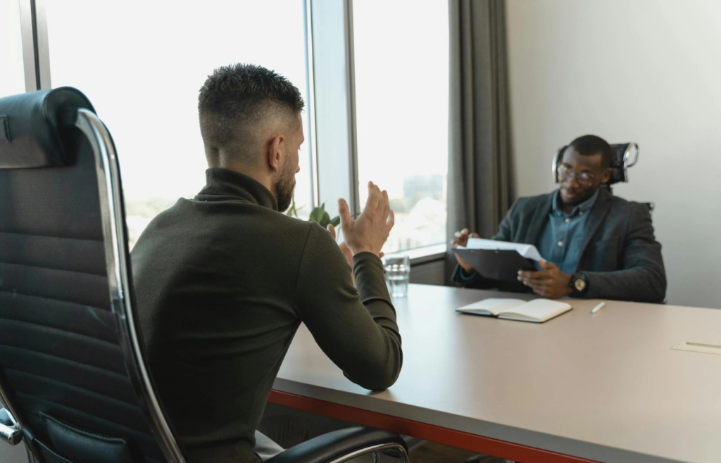 Businessman Looking at Employee