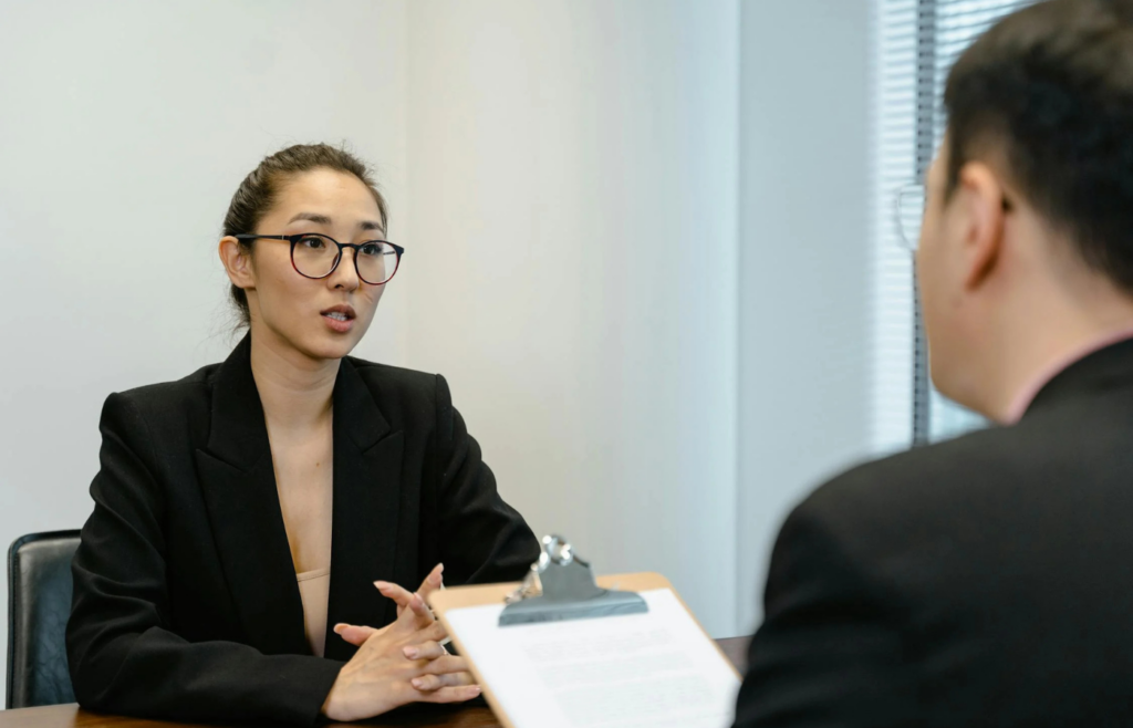 A candidate highlighting their achievements in an interview