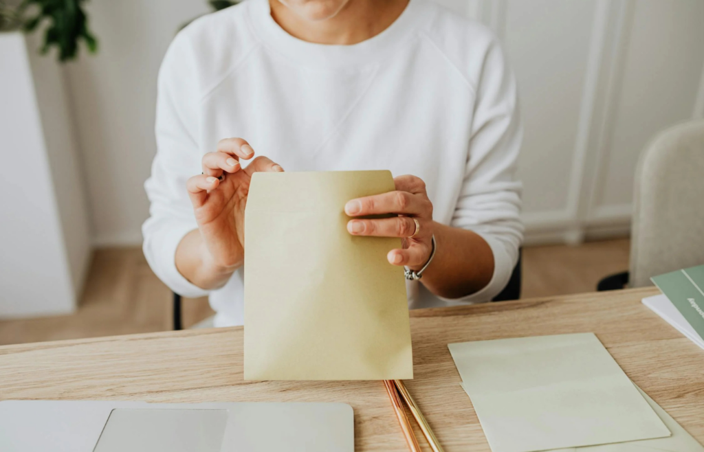 A professional holding multiple job offer letters