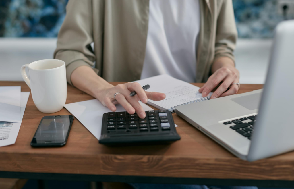A retiree calculating safe withdrawal rates on a laptop