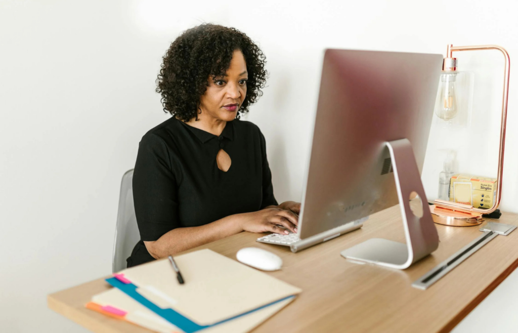 Woman in black long sleeves sitting at the table