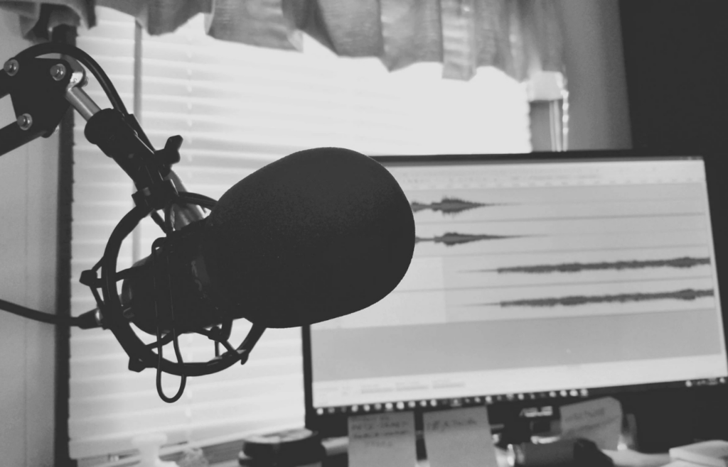 A microphone next to a digital waveform display