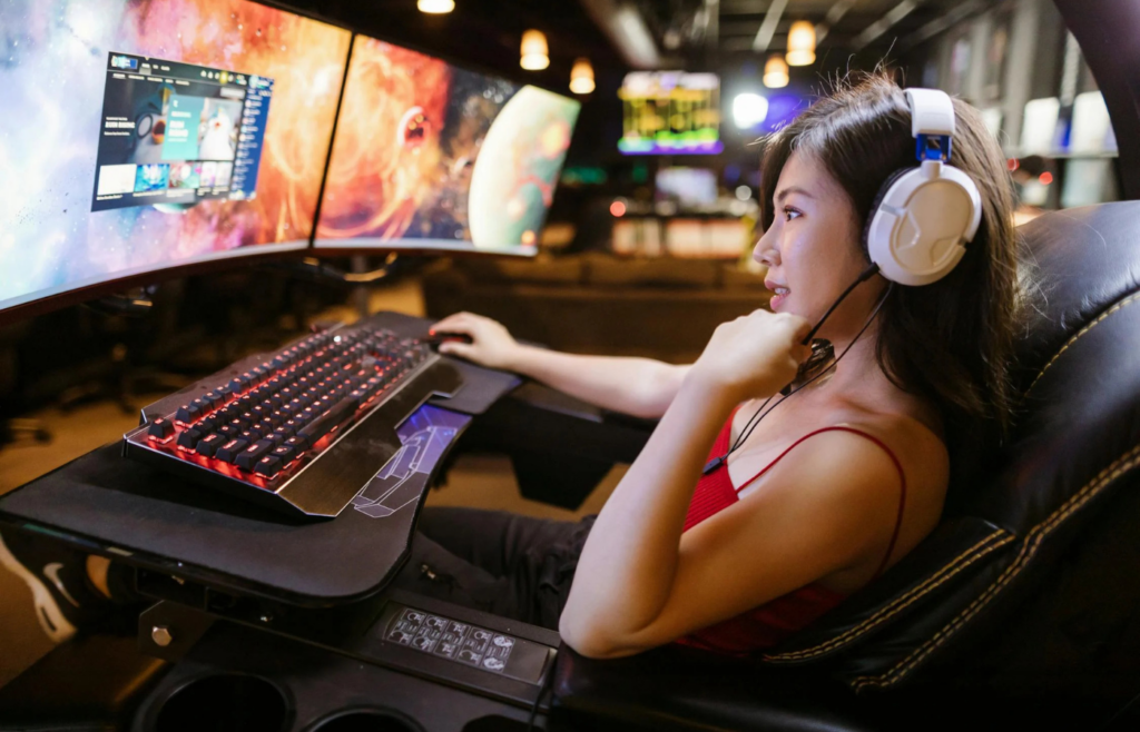 A gamer live-streaming with a headset and RGB setup