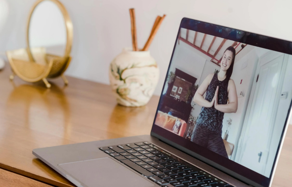 A fitness coach leading a virtual class from home