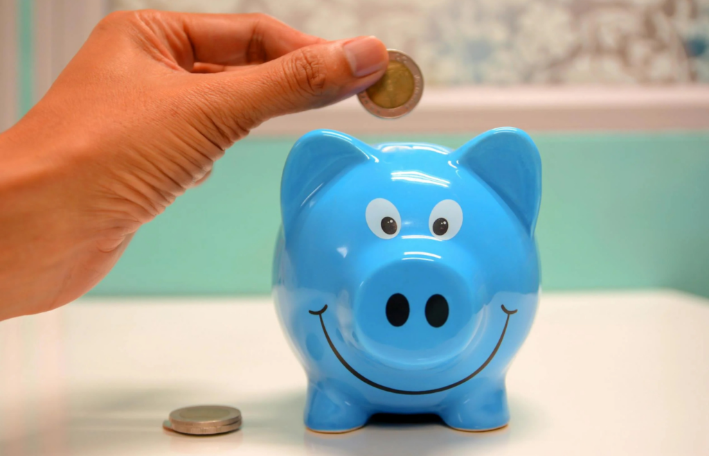 A piggy bank labeled 'Retirement' sitting empty on a shelf