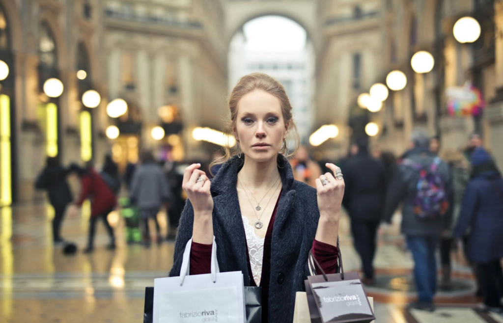 A person shopping online late at night with a stressed expression