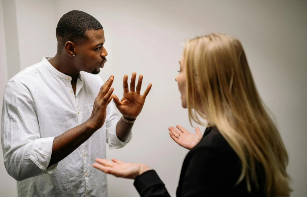 An employee pointedly ignoring a colleague's attempts to communicate