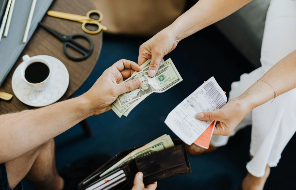 A shrinking stack of dollar bills representing decreased purchasing power