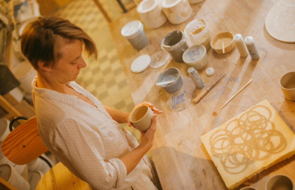 A person trying out a new hobby like pottery making