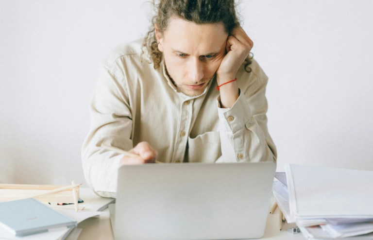 An unhappy employee at their desk
