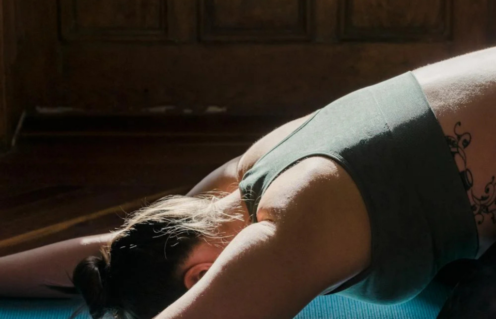 An individual meditating peacefully in a serene home setting