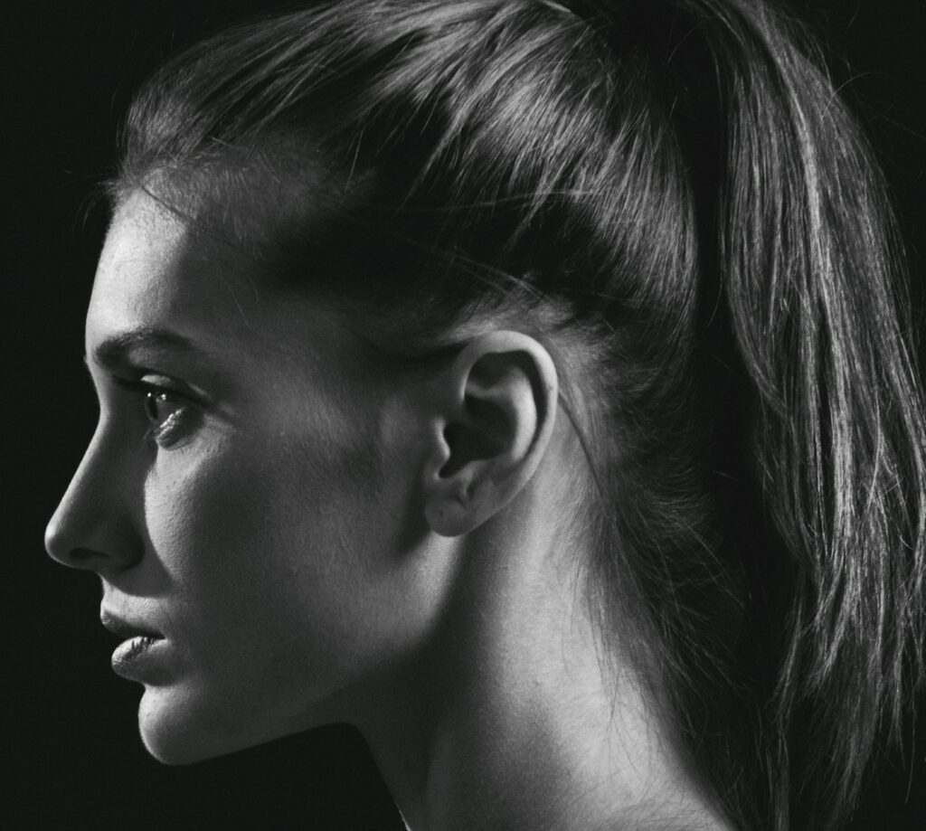 a black and white photo of a woman's profile