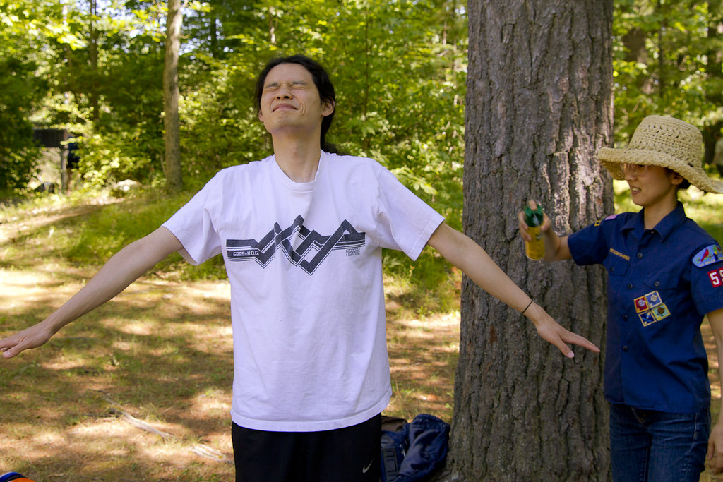 Kahori sprays Jon with bug spray which would prove terribly inadequate by weekend's end. Jon's sweet sweet blood was too much to resist.