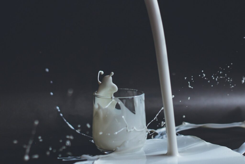 milk being poured into a glass
