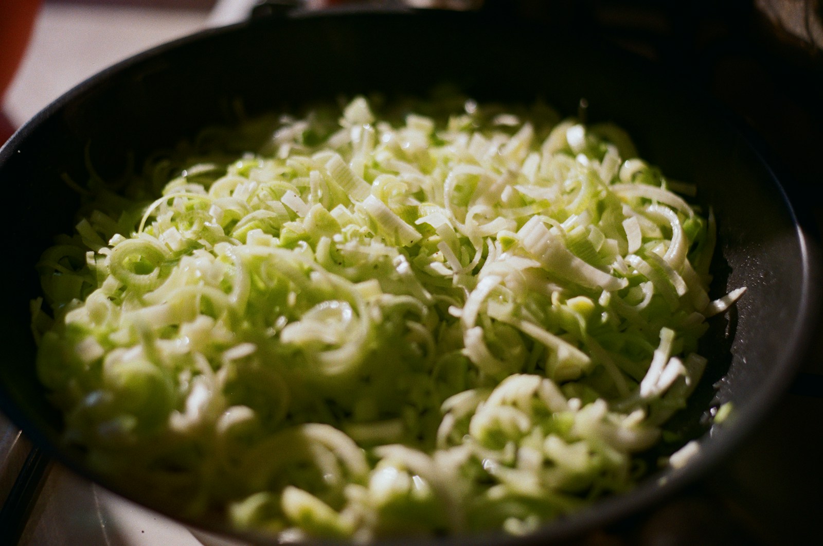 A close up of a pan of food on a stove