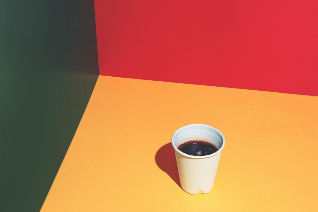 a cup of coffee sitting on top of a table