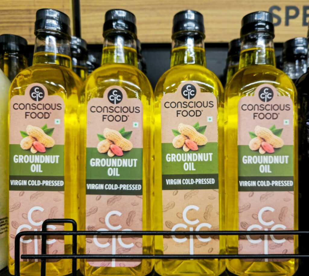 Four bottles of conscious food groundnut oil