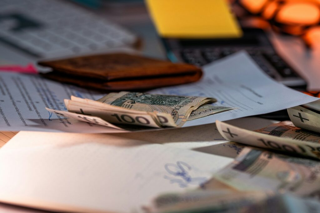 Money and documents on a desk.