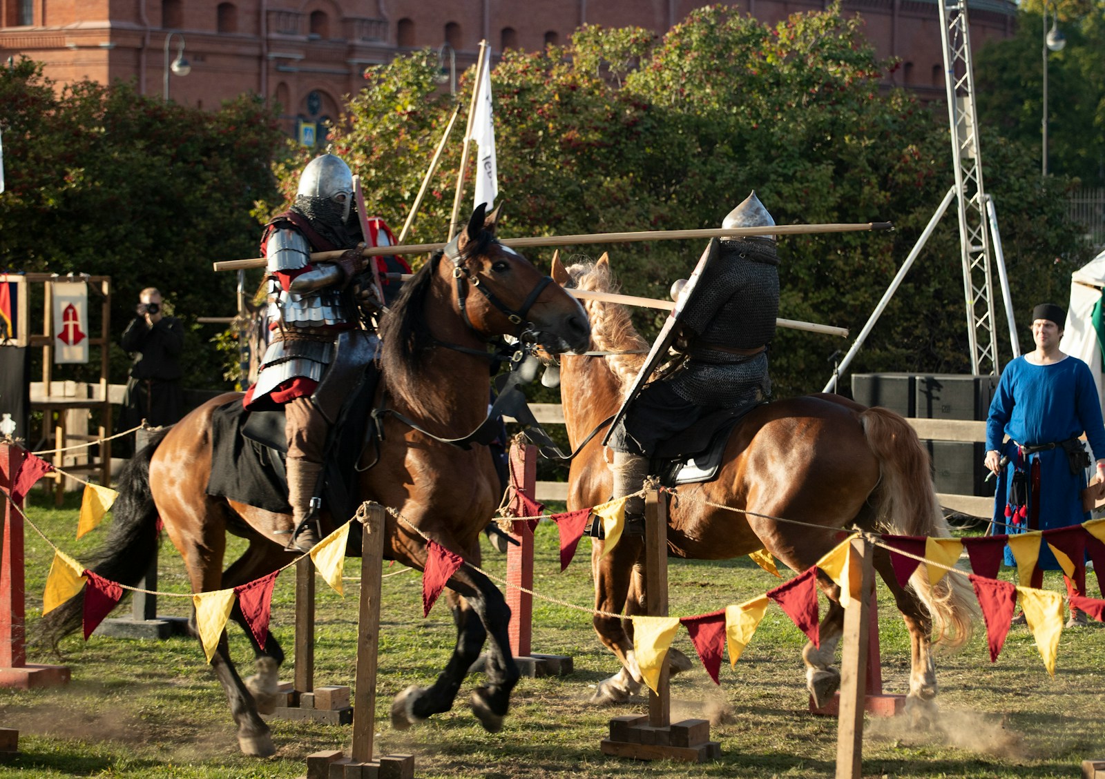 A couple of men riding on the backs of brown horses