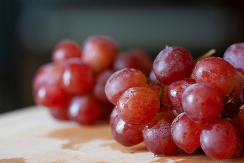 grapes on brown wooden table