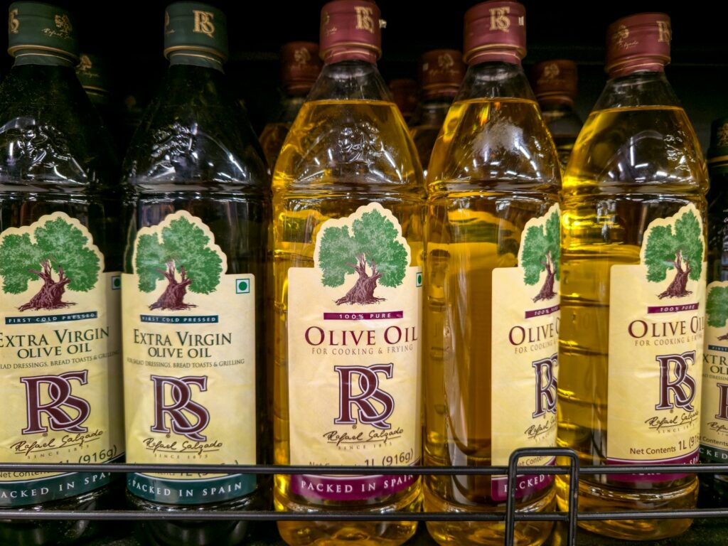 Bottles of olive oil on a shelf