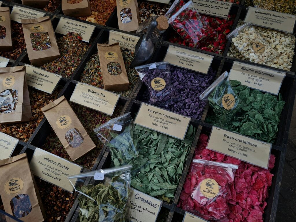 Various herbs and spices are displayed in a market.