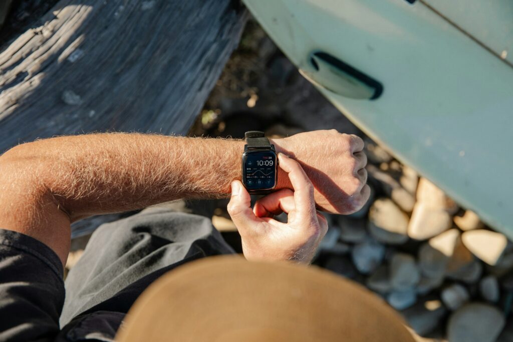 Man checking time on his watch outdoors
