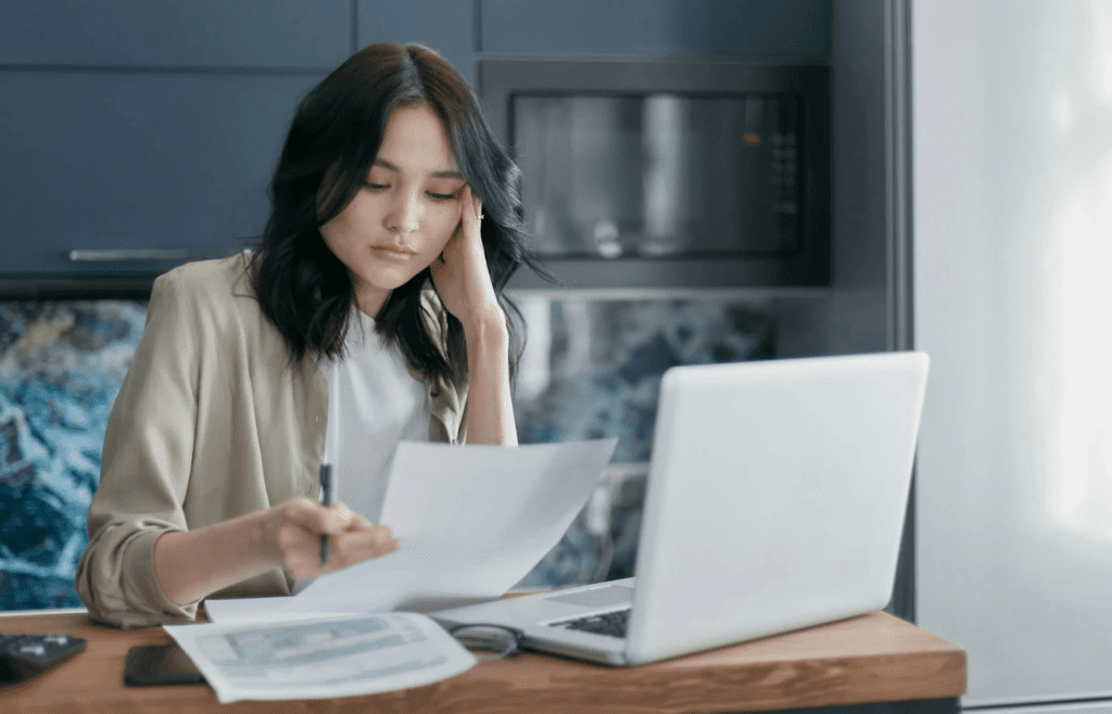 woman looking at paper