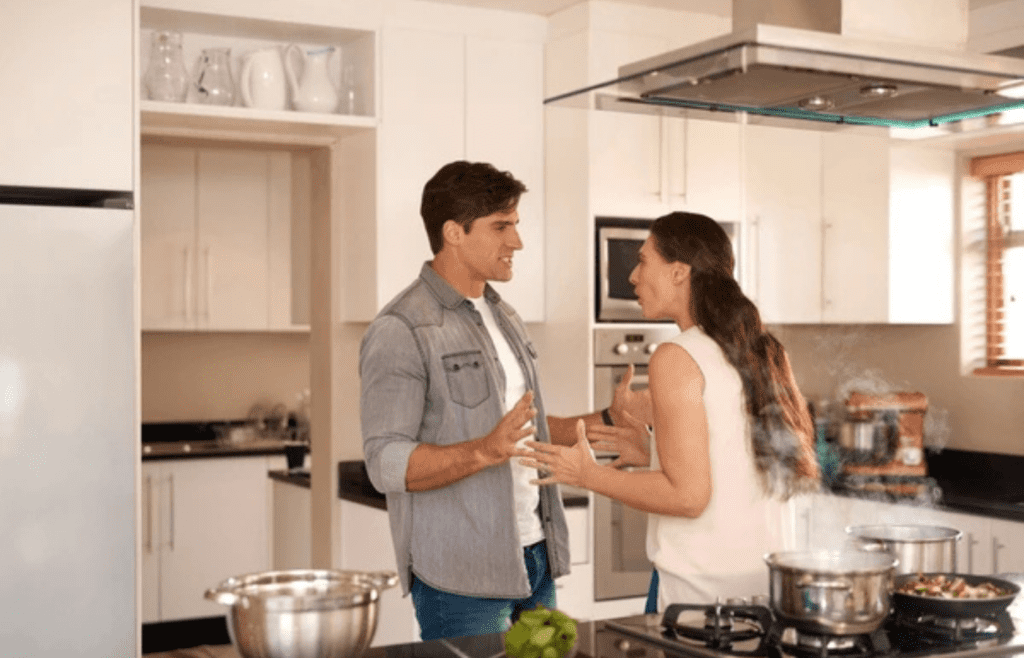 man and woman in kitchen