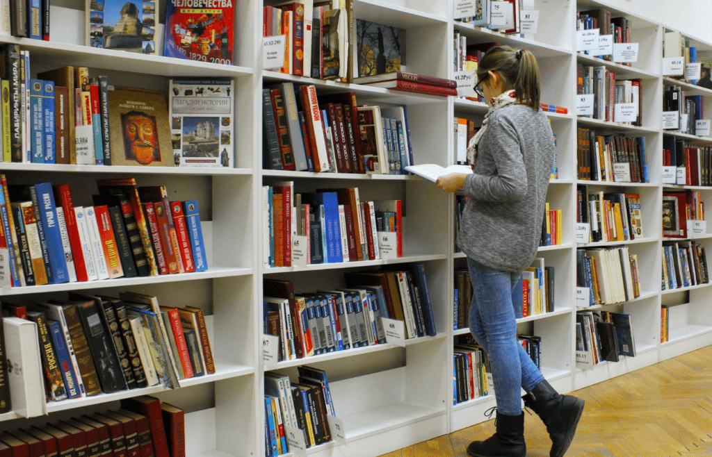 woman looking at book selection