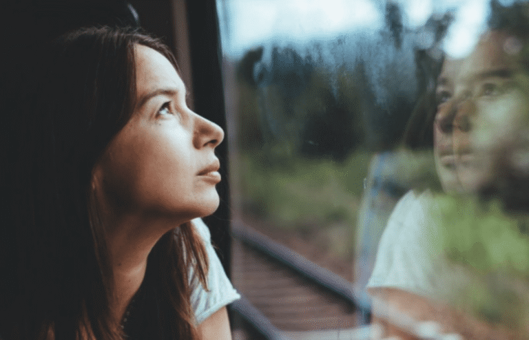 woman looking out the window