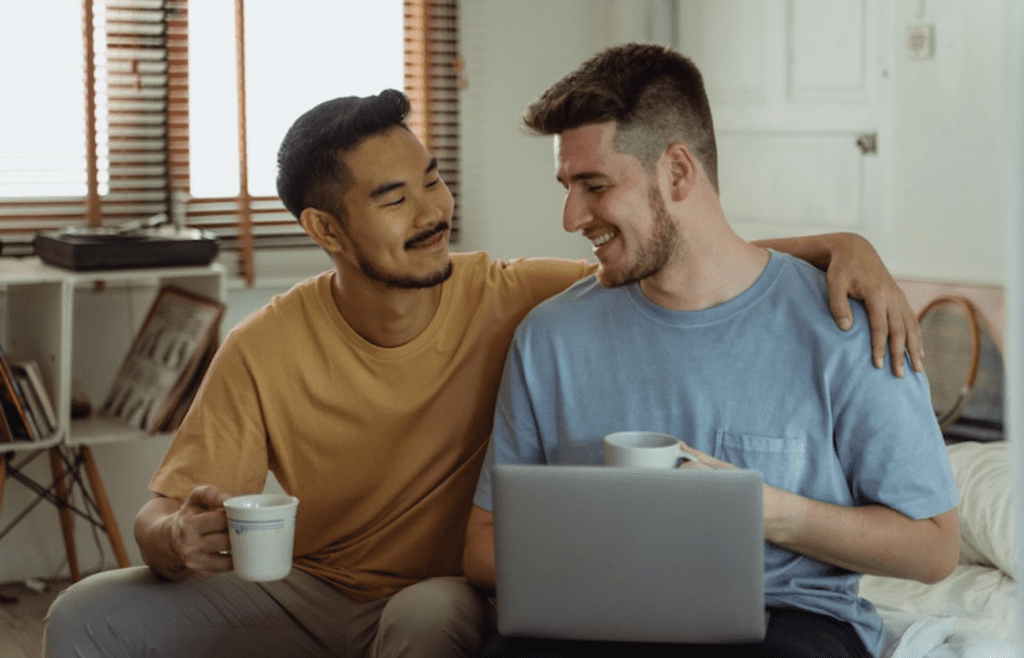 two men smiling at each other