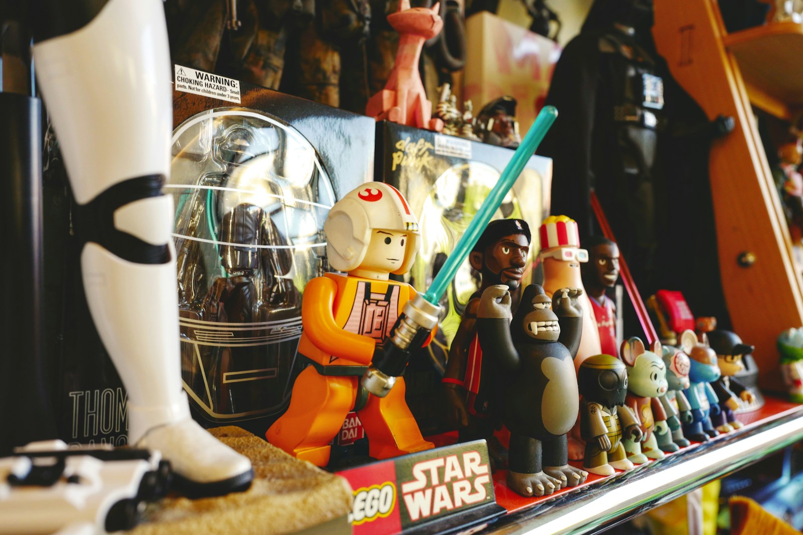 a shelf full of star wars toys and figurines