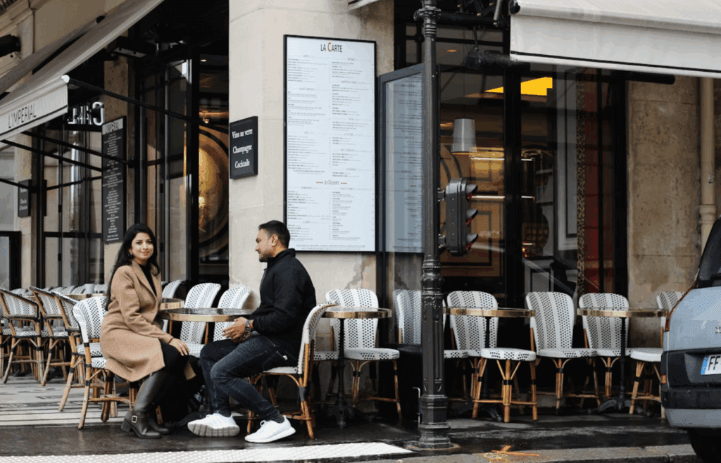 man and woman outside cafe