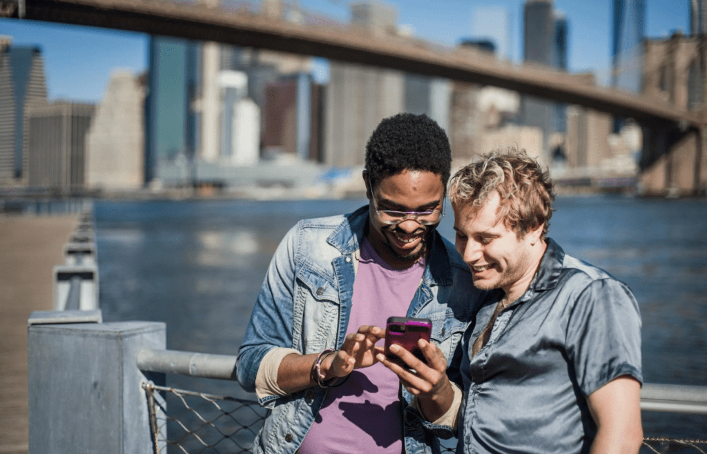 two people looking at a phone