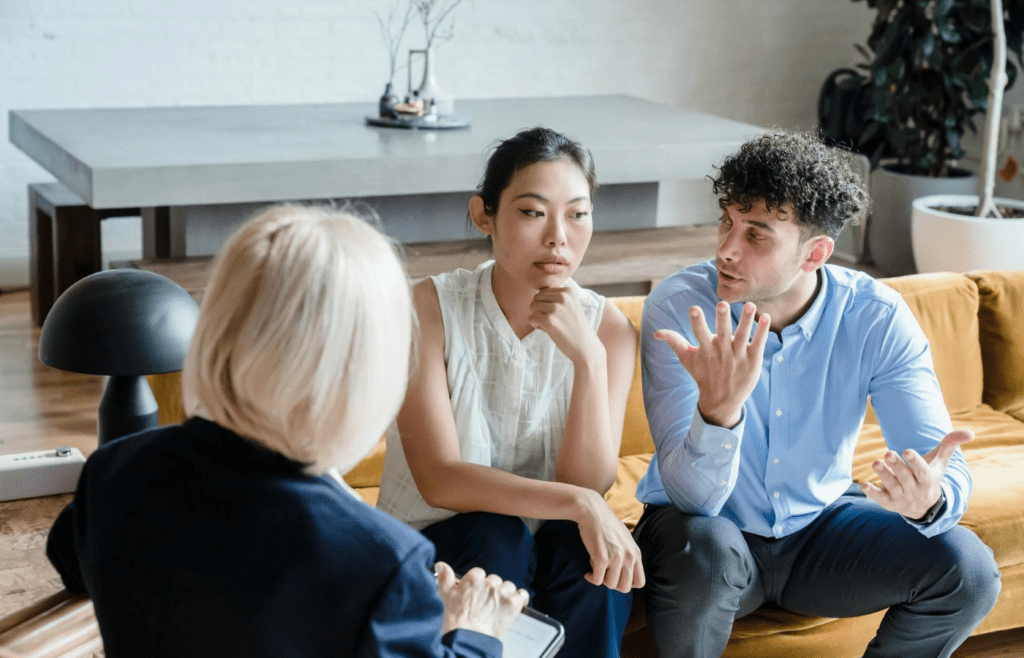 three people having a discussion