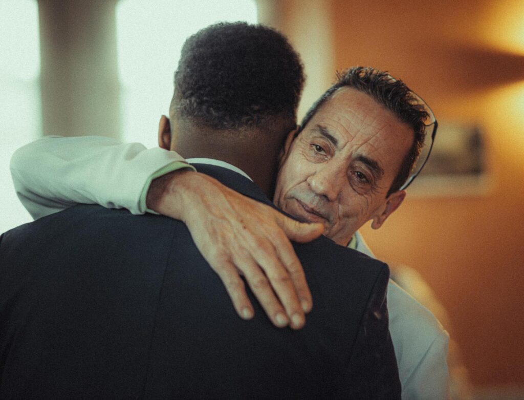 Heartfelt hug between two adults, conveying deep emotions and connection.